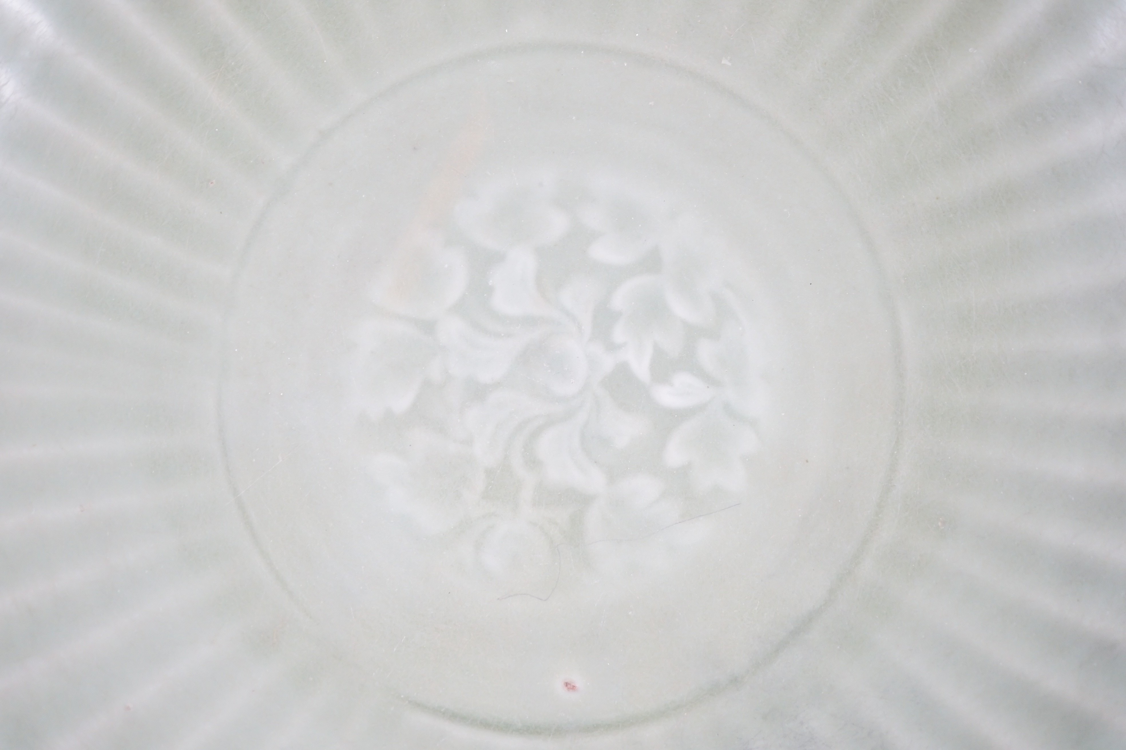 A Chinese Ming Longquan celadon flower moulded dish, 15th century, 34.5cm diameter, scratching to glaze